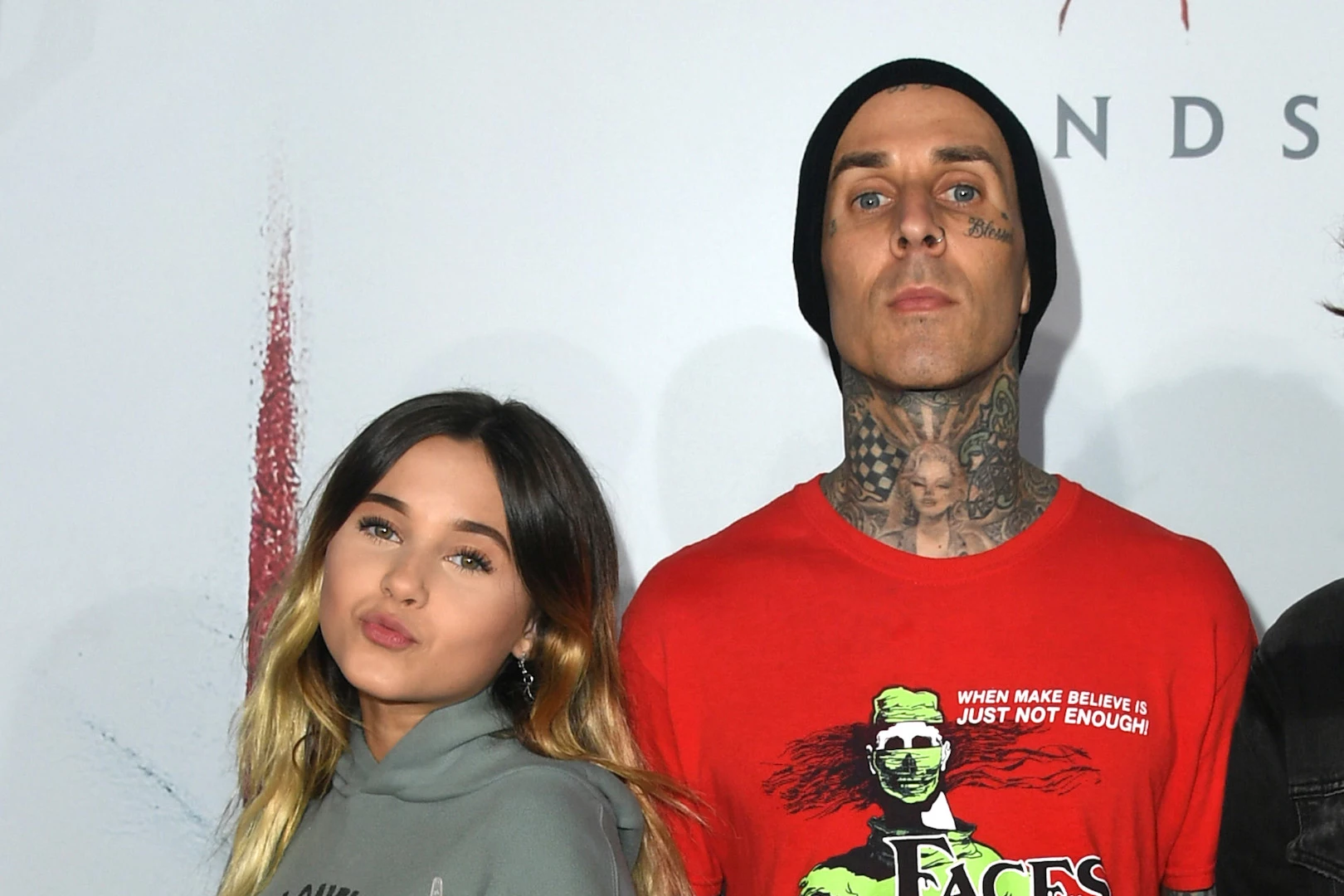Watch Travis Barker S Daughter Cover His Face Tattoos With Makeup