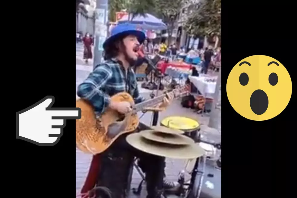 Street Musician Plays Huge Iron Maiden Hit on Guitar + Drums at the Same Time