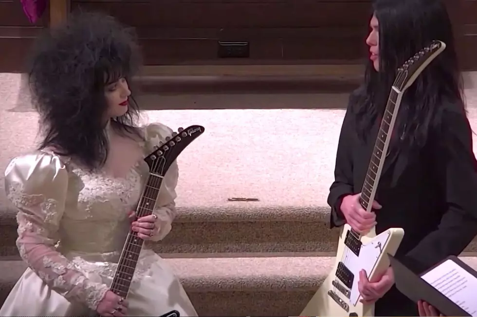 Metal Couple Exchange Guitars Instead of Rings at Their Wedding