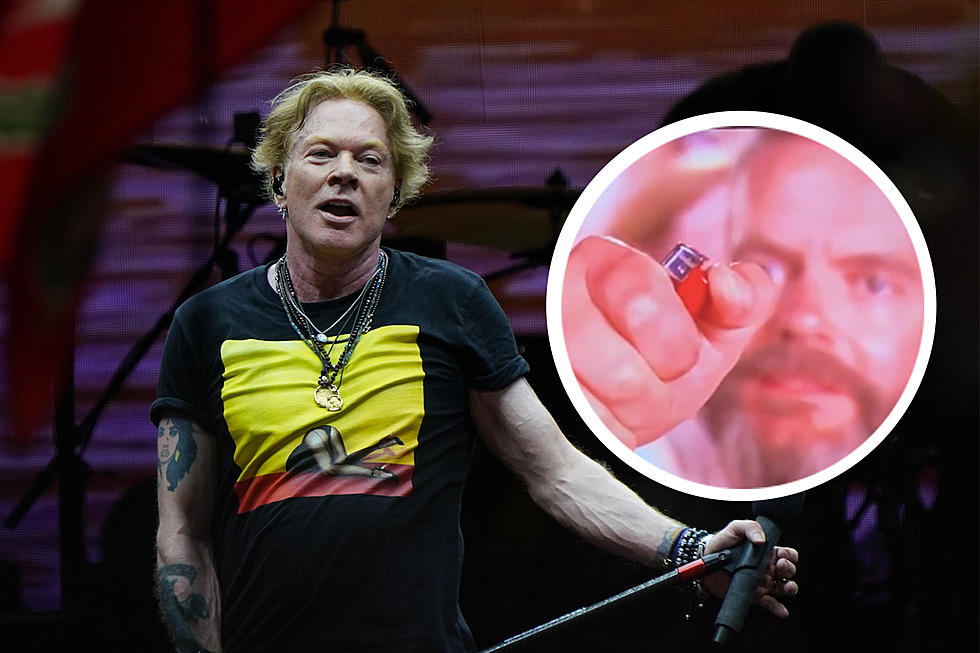 Guy Struggles to Hold Lighter During Guns N' Roses' Festival Set