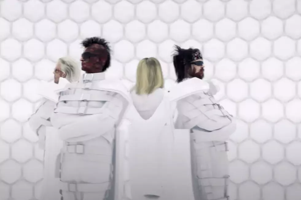 motley crue straitjackets in 'Dogs of War' video
