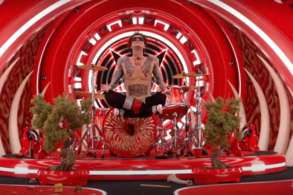Motley Crue Tommy Lee Meditating Amidst Bonsai Trees in 'Dogs of War' video