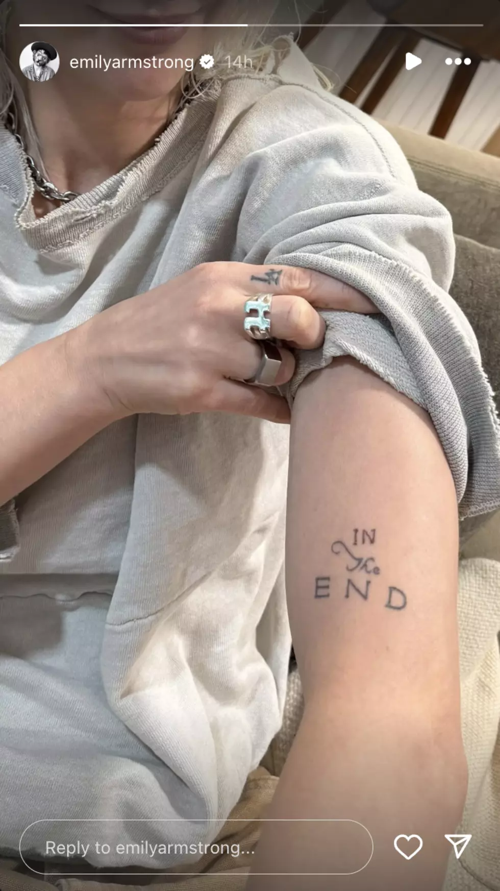 Emily Armstrong's arm showing Linkin Park "In the End" Tattoo