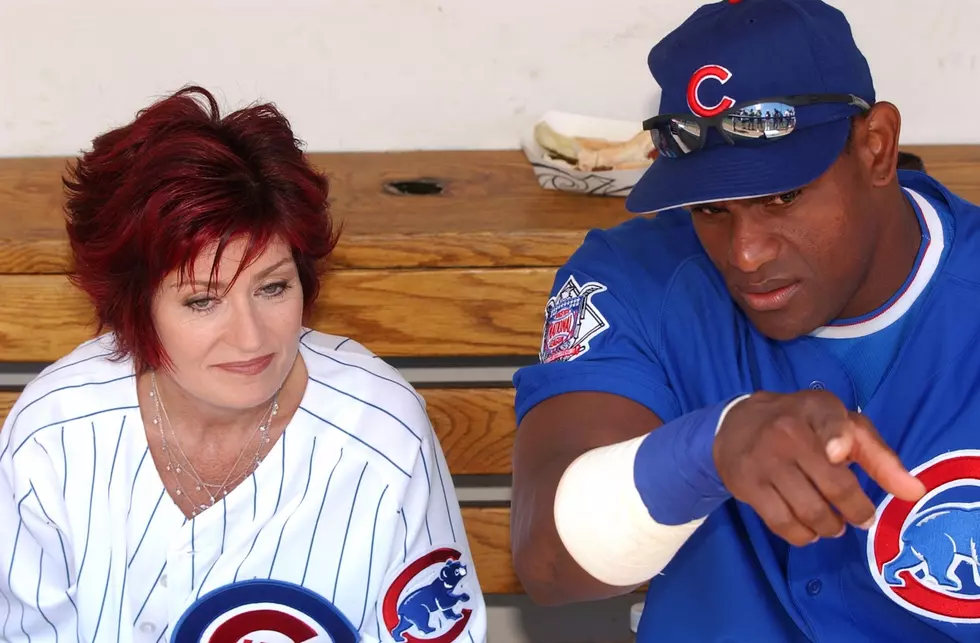 Sharon Osbourne and Cubs player Sammy Sosa in the dugout at Wrigley Field in Chicago.