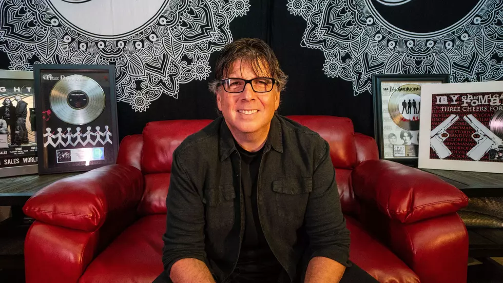 howard benson sitting in front of gold and platinum records