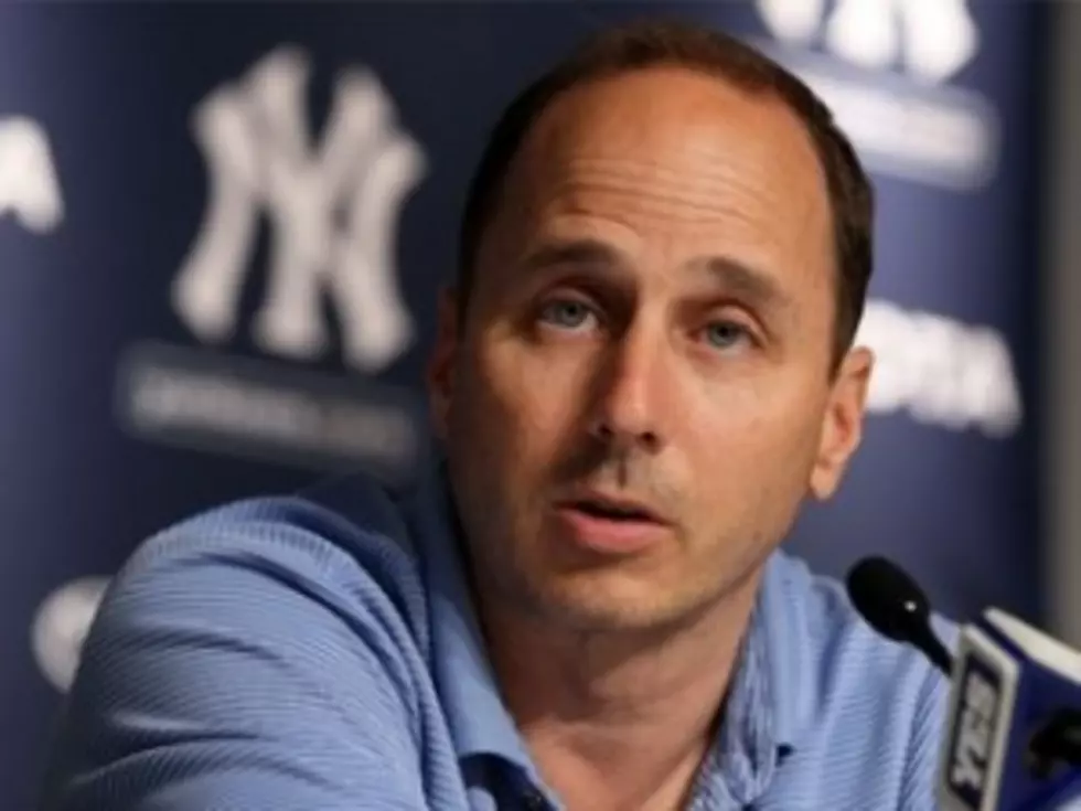 Woman Charged with Extorting Yankees&#8217; GM Cashman