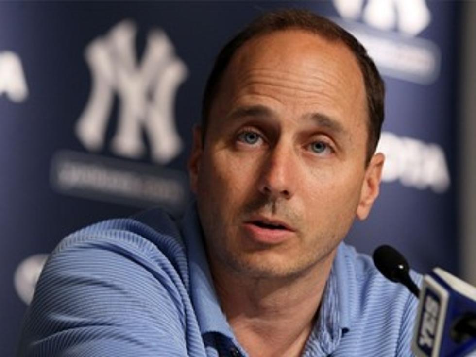 Woman Charged with Extorting Yankees’ GM Cashman