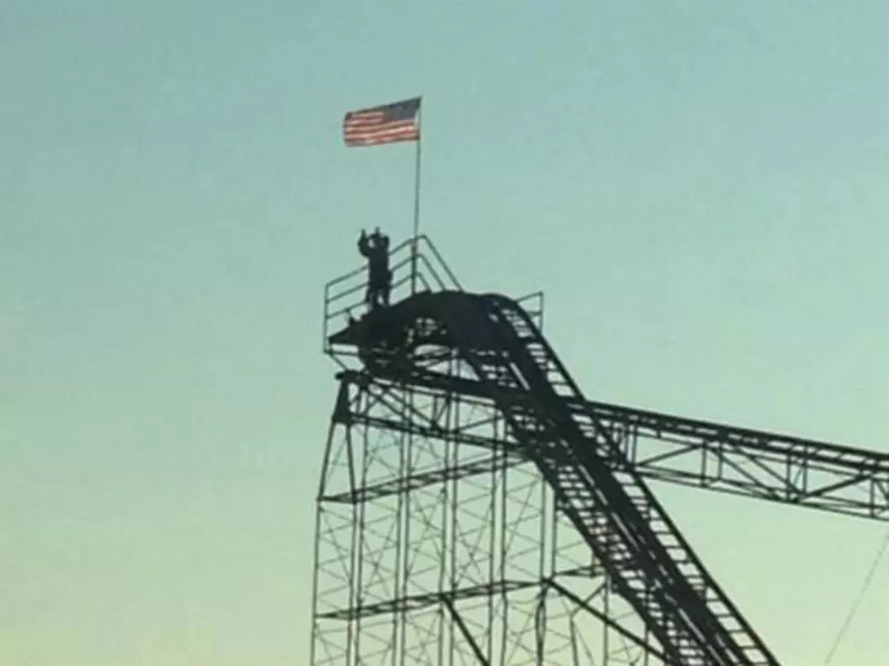 Man Climbs Onto Roller Coaster