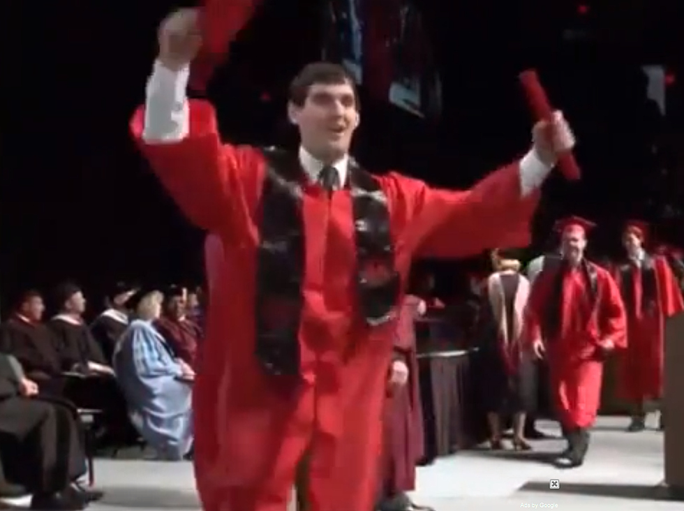 Graduate Attempts Backflip and Fails [VIDEO]