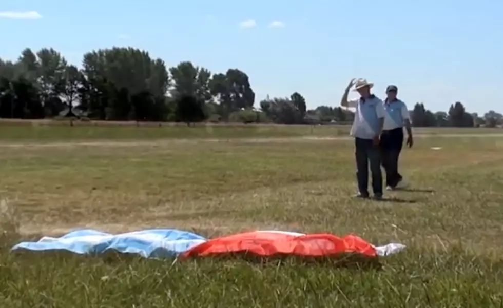 Plane pulls off amazing stunt to snag flag off ground [Video]