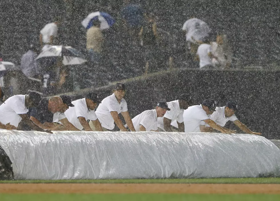Yanks beat Darvish in rain-shortened game
