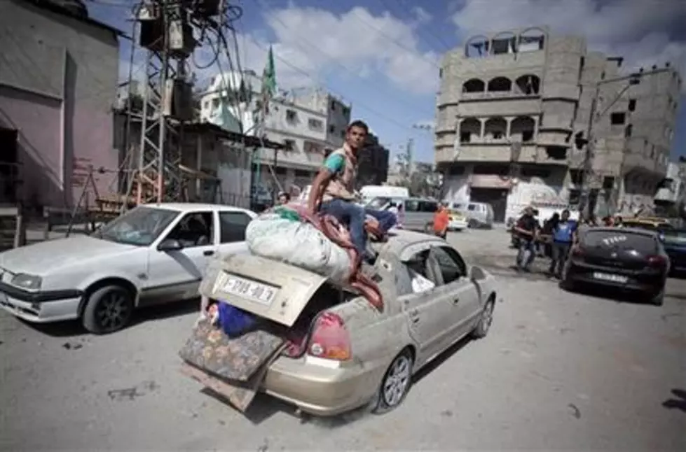 In Gaza lull, residents return to destroyed areas