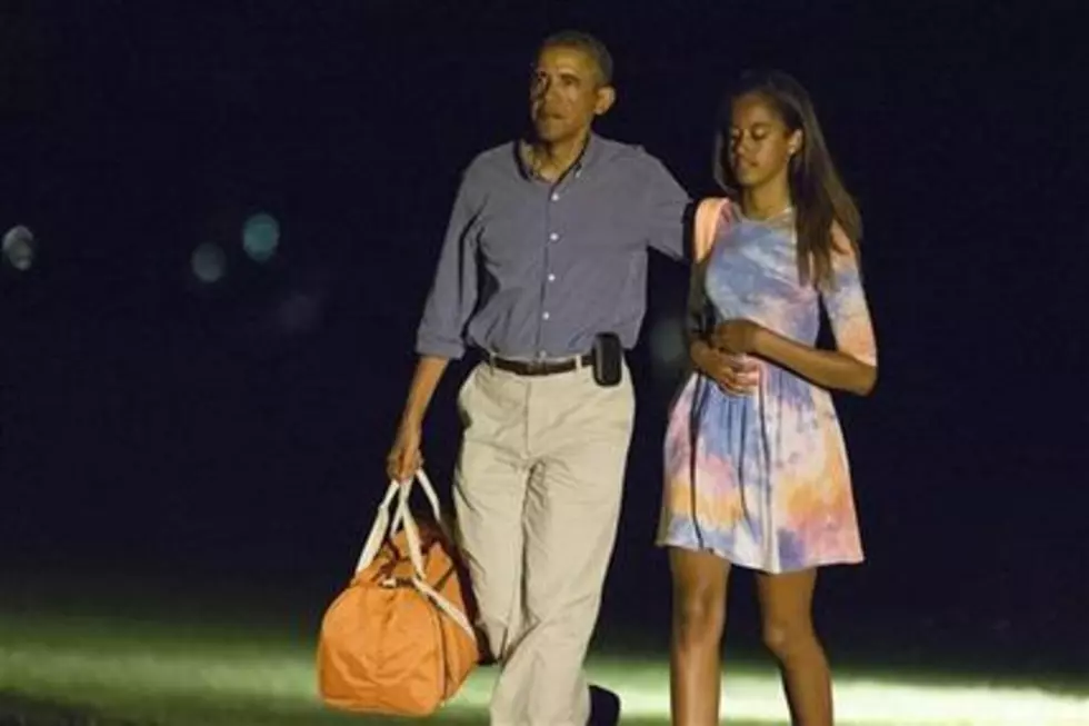 Obama back in Washington on rare vacation break