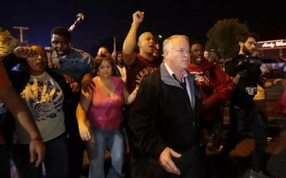 Police, protesters scuffle after Ferguson apology
