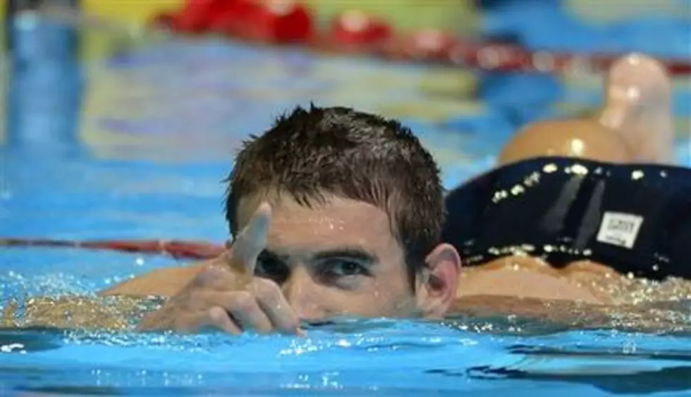 Phelps says swimming on hold after DUI arrest