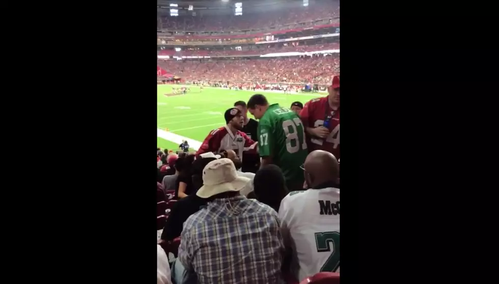 WATCH: Eagles fan fights Cardinals fans during game