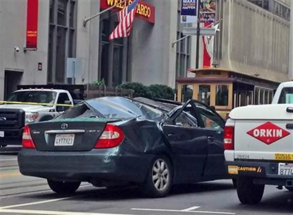 San Francisco window washer falls onto moving car