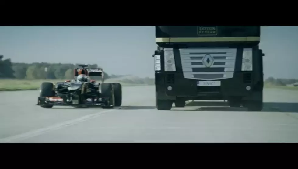 WATCH: Semi tractor trailer jumps over F1 race car in amazing stunt