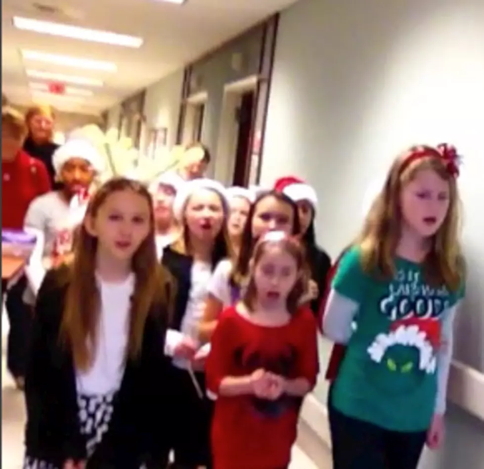 WATCH:  Howell Girl Scout Troop 810 caroling for rehab patients