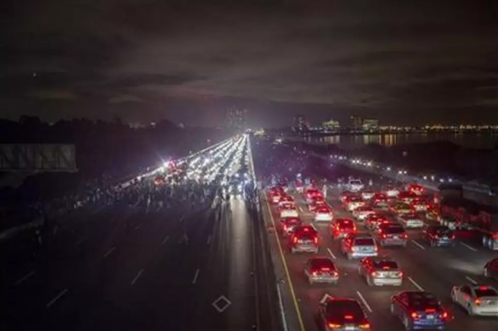 Protesters block highway, stop train in California