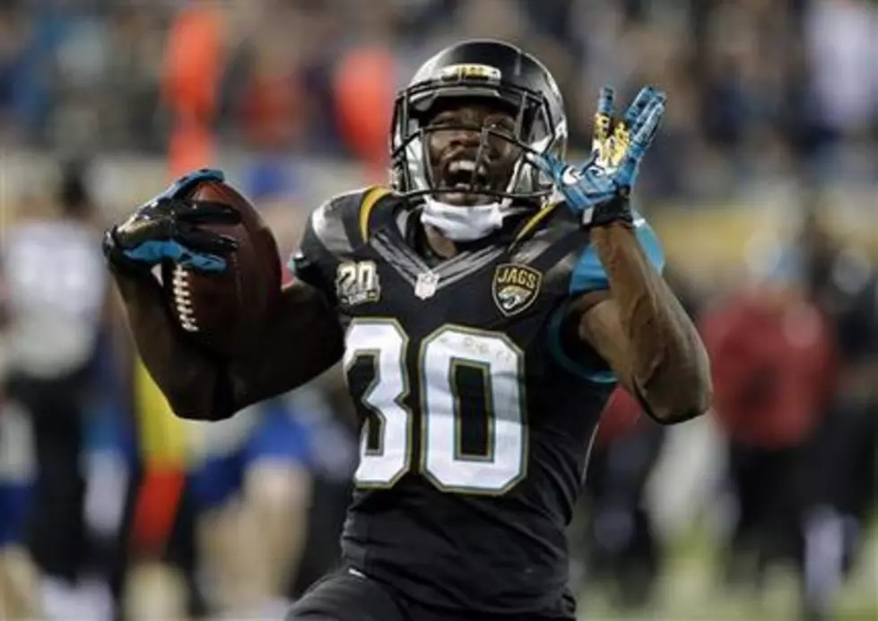 Jaguars hold off Titans late, win 21-13 in home finale