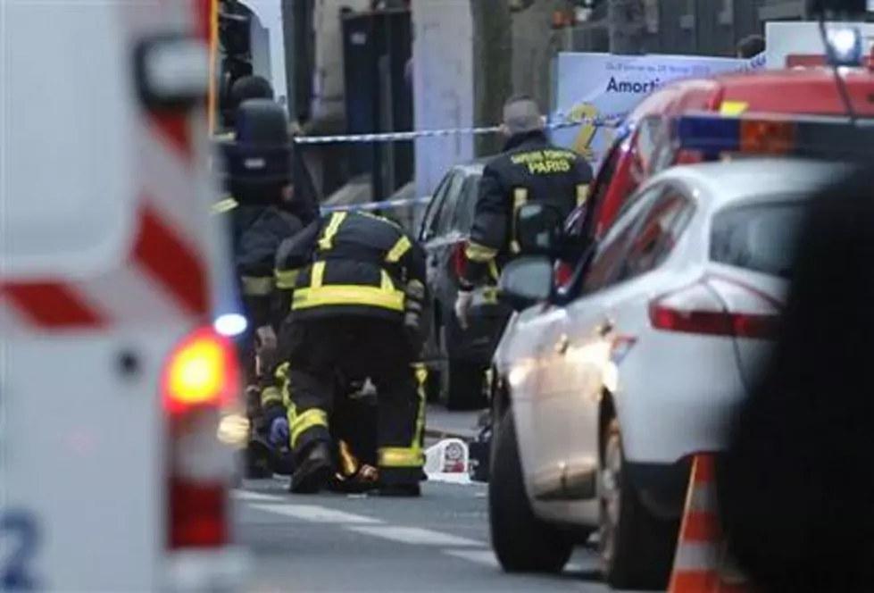 2 shot at Paris’ edge, including officer, amid high tension