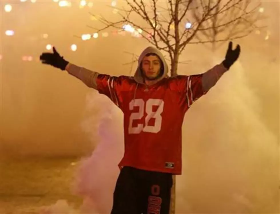 Police use tear gas as Ohio State football revelers set fires