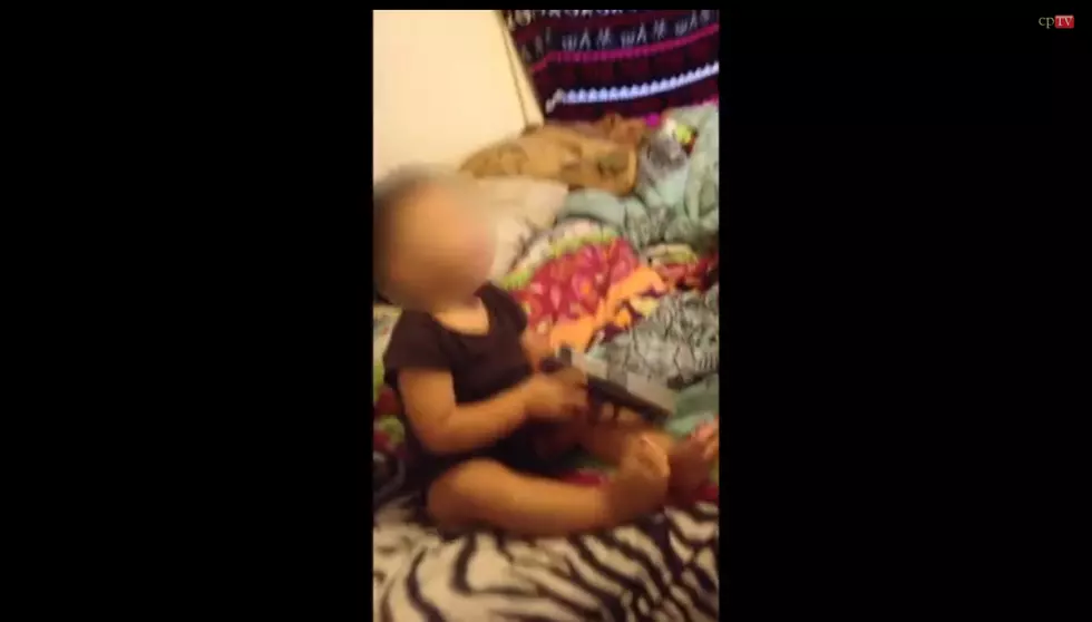 WATCH: Frightening video shows toddler holding a gun in mouth