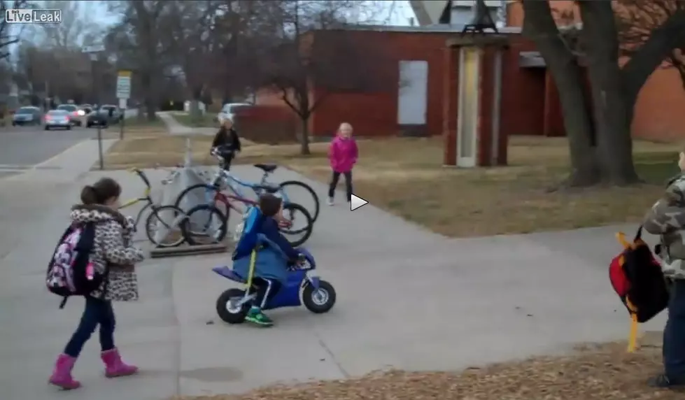 WATCH: Adorable kid rides mini motorcycle to kindergarten