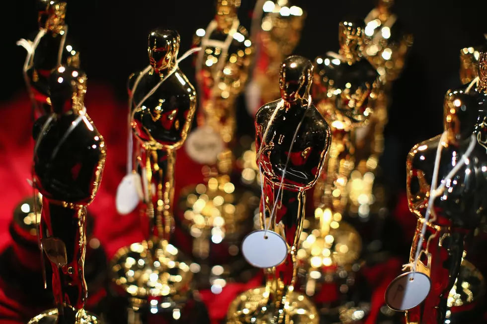 Who hands over the Academy Awards statuettes? Team Oscar