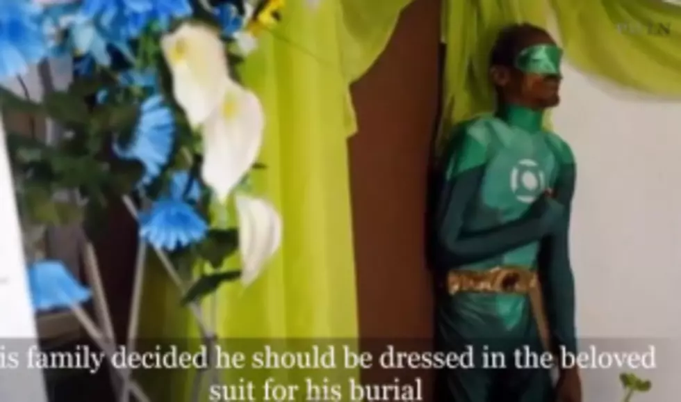 Watch: Dead man propped up in Green Lantern costume at his wake