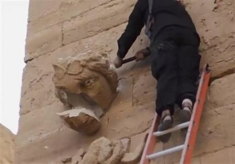 ISIS militants smash and shoot Iraqi archaeological site