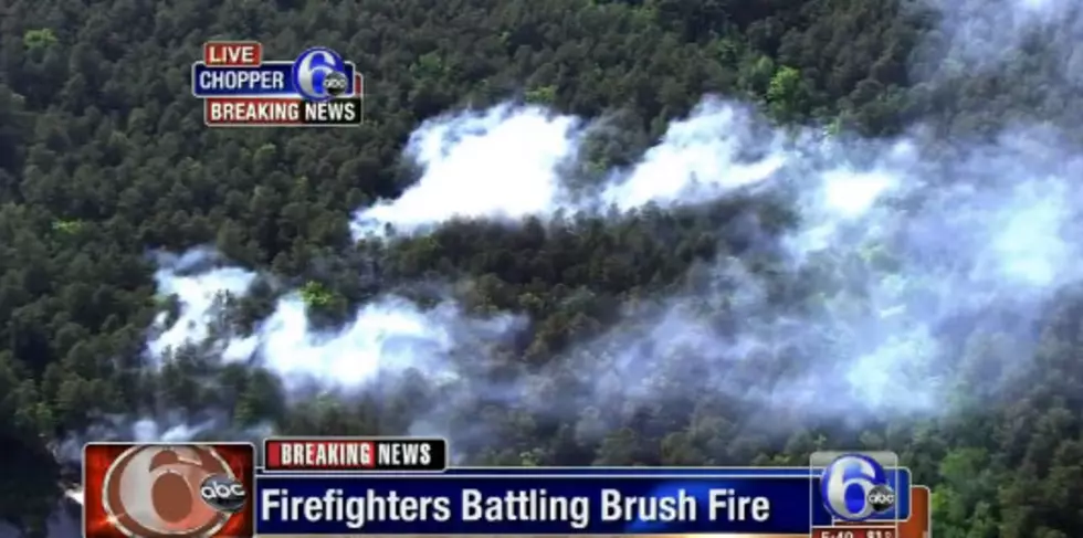 Brush fire burns several acres near Six Flags