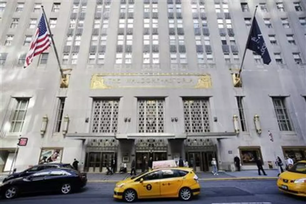 4 hurt when gun goes off at Waldorf Astoria, 2 charged