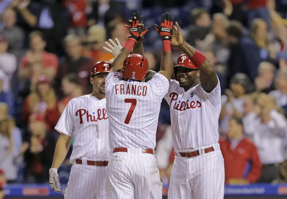 Phillies rally again, beat Reds in extras