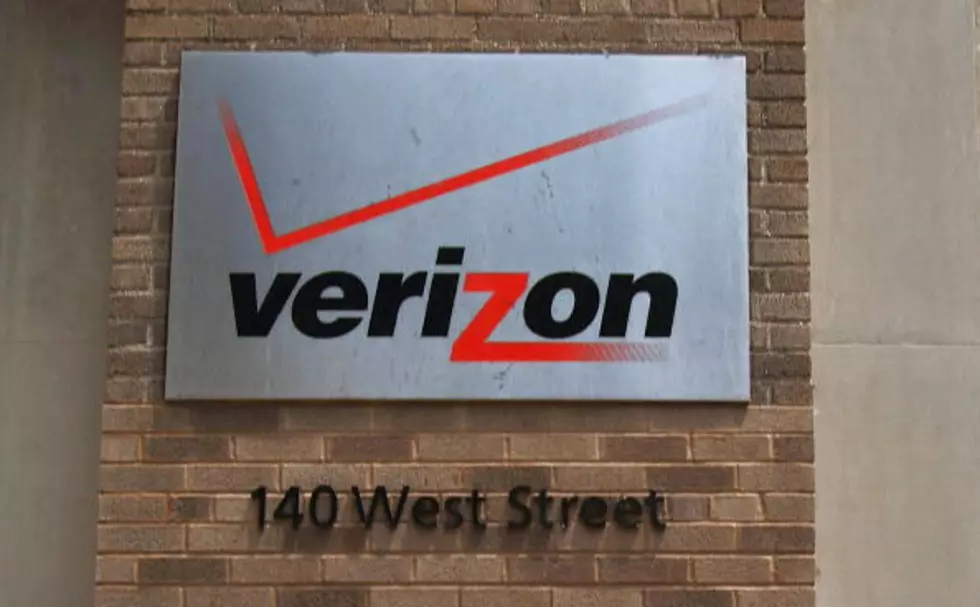 A Verizon logo is displayed on a building in New York City