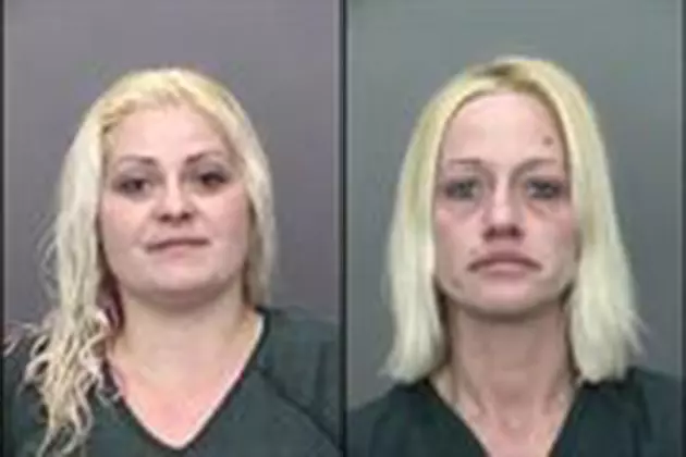 Women accused of setting fire, with kids and grandparents inside, to kidnap child