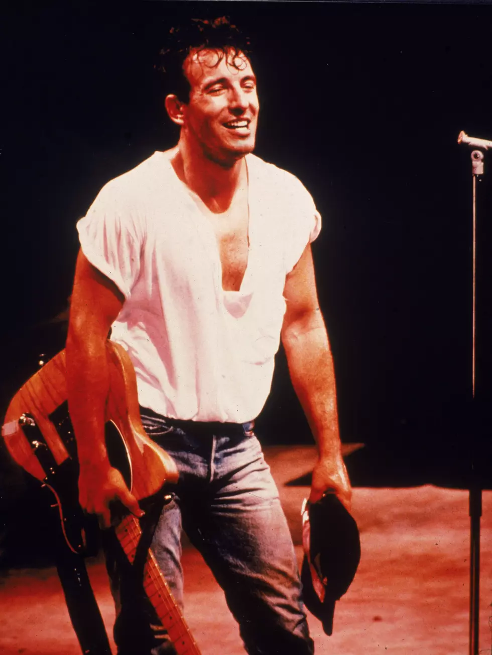 Bruce Springsteen Holds Guitar On Stage