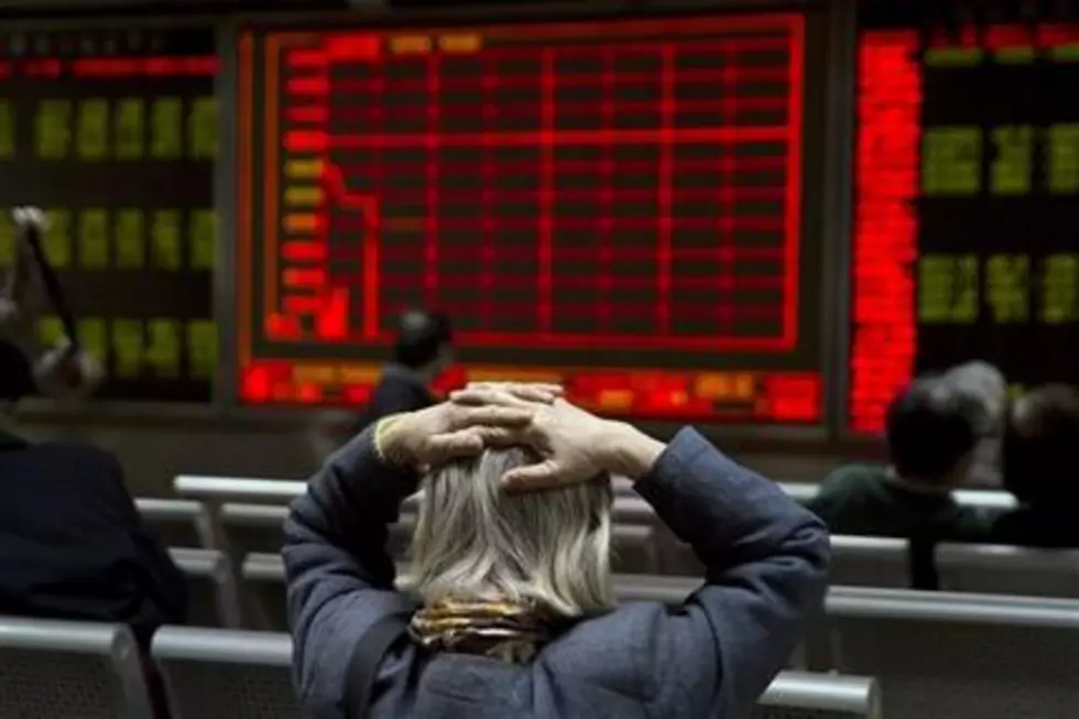 World stocks slide as China trading halted after plunge