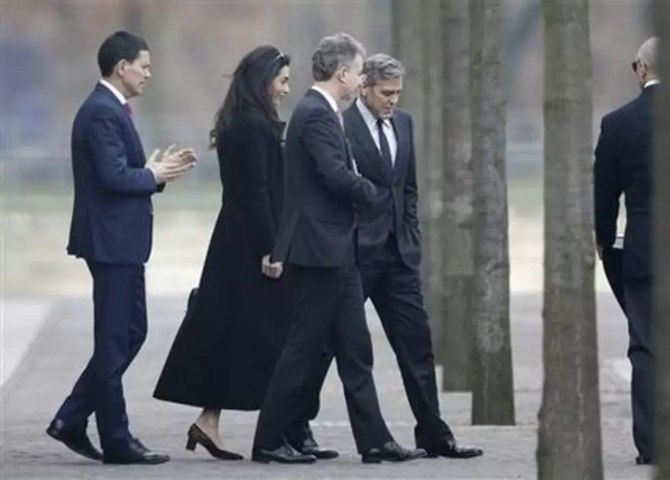 George and Amal Clooney meet Merkel to discuss refugees