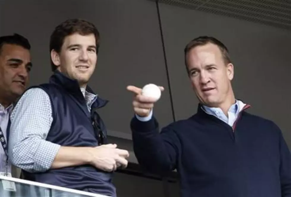 Peyton Manning has a little fun with little brother Eli