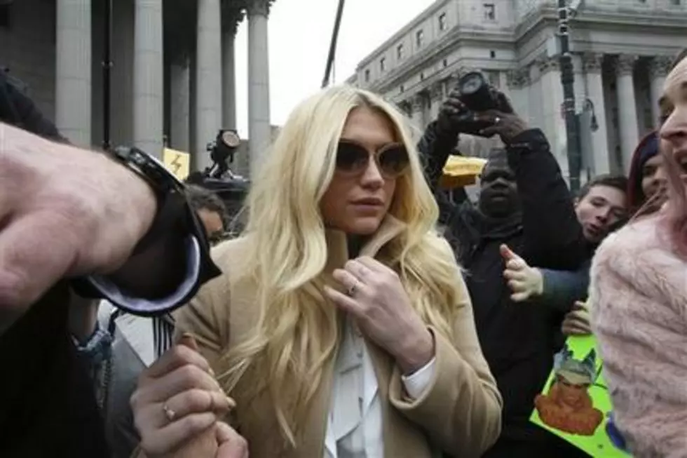Kesha chokes up at award dinner, thanks supporters