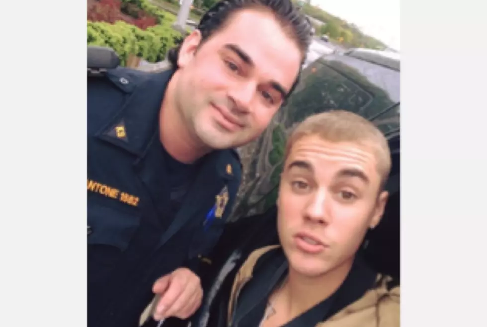 Justin Bieber convinces NJ cop to pose with him for photo