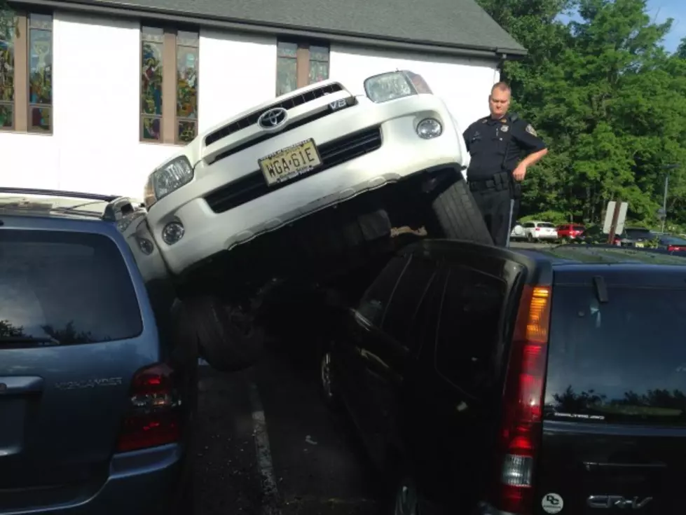 How did this happen? SUV lands atop 2 other vehicles in church parking lot