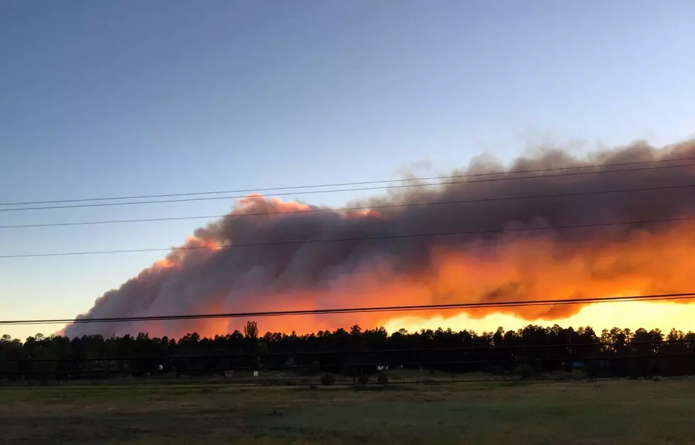 Crews make progress against home-threatening Western fires