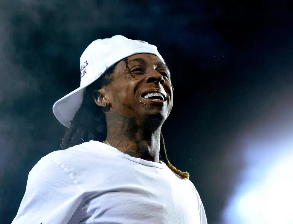 Rapper Lil Wayne hospitalized after 2 seizures on plane