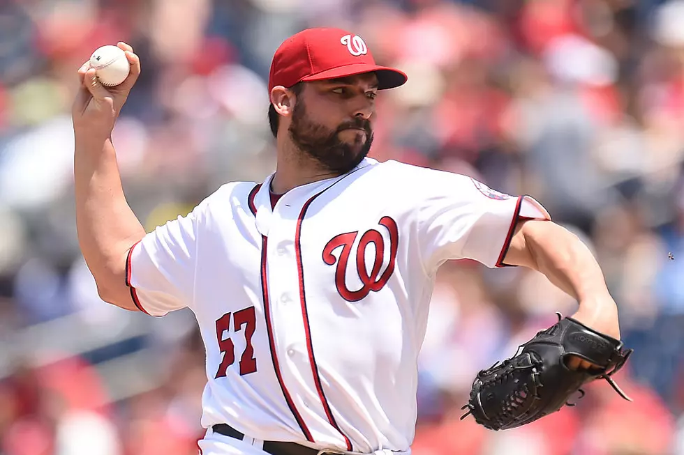 Roark uses arm, bat to carry Nationals past Phillies 8-0