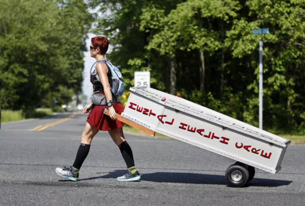 NJ woman tows casket on foot for 3 days across NJ to demand mental health reform