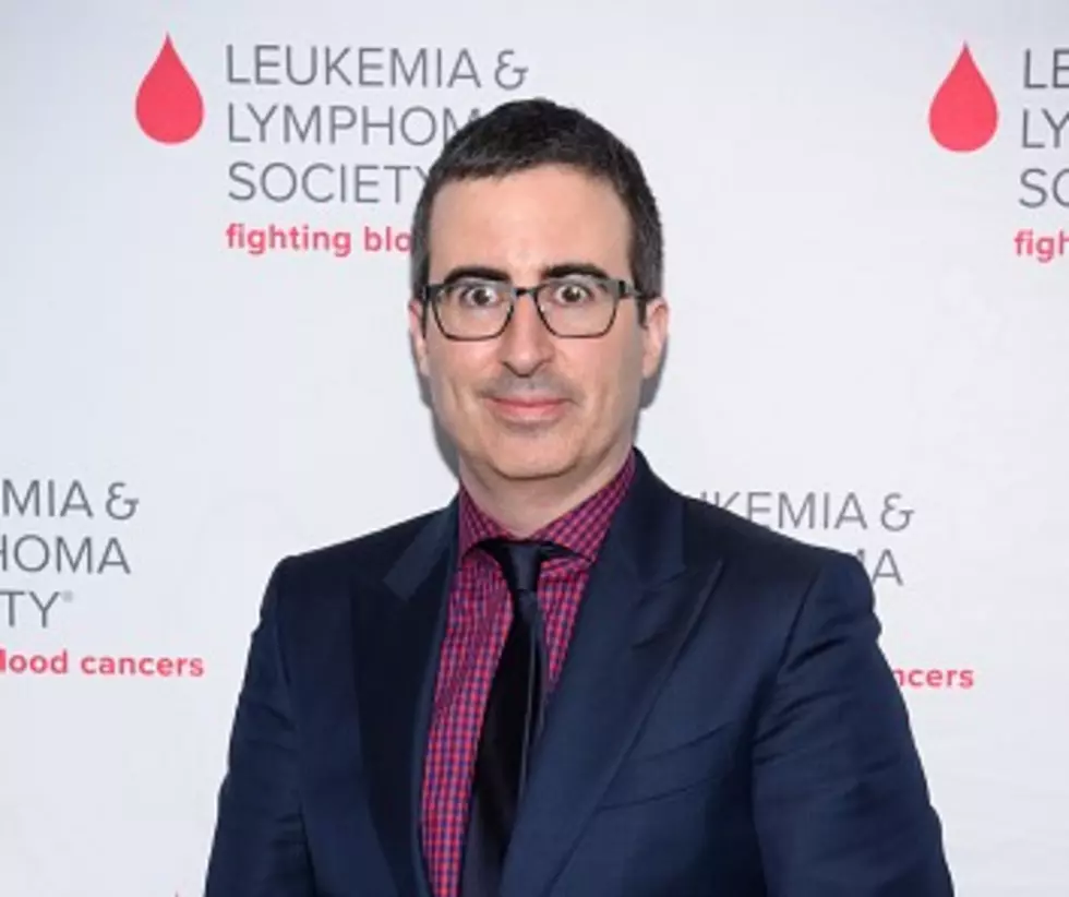 John Oliver buys and forgives $15 million in debt