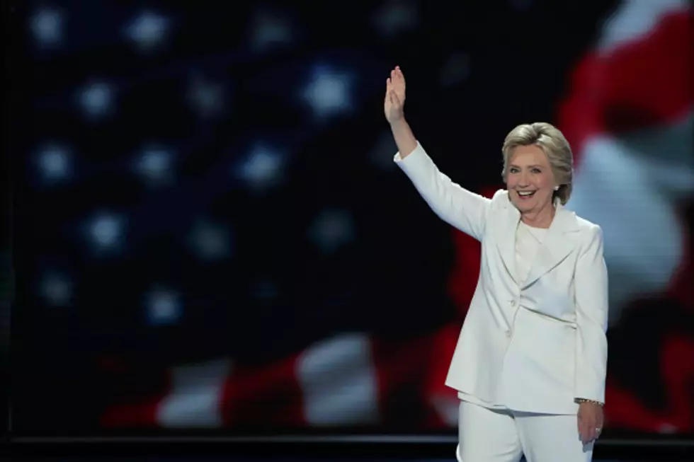 Clinton promises steady hand in dangerous world